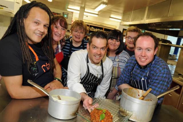 NELSON  08-04-16
Reporter Will Cook, right, and head chef Mark Taft, centre, with other budding chefs and food lovers on the Perfect Pasta course, held at the catering department at Nelson and Colne College.