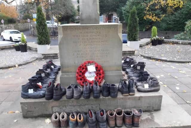 Boots placed around the War Memorial representing the lads who did not
return